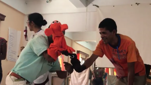 Soluf gives birth to Mr Poop – then wipes his butt. Hand-washing skit session, NSI workshop, Madagascar October 2017